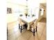 Bright dining room with chandelier, window and sliding door to lanai at 4250 Roberta Dr, Winter Haven, FL 33881