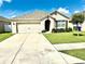 Charming single-story home featuring a well-maintained lawn and a two-car garage at 4250 Roberta Dr, Winter Haven, FL 33881