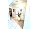 Hallway with tile flooring leading to rooms and features a decorative vase at 4250 Roberta Dr, Winter Haven, FL 33881