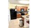 Modern kitchen features dark appliances and granite countertops at 4250 Roberta Dr, Winter Haven, FL 33881