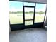 Open-air lanai with views of lake and lush greenery at 4250 Roberta Dr, Winter Haven, FL 33881