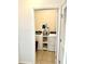 Bright laundry room featuring modern washer and dryer, and shelving for storage at 4250 Roberta Dr, Winter Haven, FL 33881