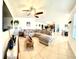 Open concept living room featuring neutral tones, ceiling fan and tiled floors at 4250 Roberta Dr, Winter Haven, FL 33881