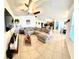 Open concept living room featuring neutral tones, ceiling fan and tiled floors at 4250 Roberta Dr, Winter Haven, FL 33881