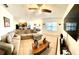 Open concept living room featuring neutral tones, ceiling fan and tiled floors at 4250 Roberta Dr, Winter Haven, FL 33881