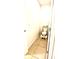 Cozy toilet room features tiled floor, toilet and storage at 4250 Roberta Dr, Winter Haven, FL 33881
