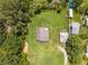 Aerial view of the property including the home, garage, yard, and surrounding trees at 431 Eastern Ave, St Cloud, FL 34769