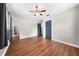 Bedroom featuring sleek hardwood floors, ceiling fan, and neutral wall colors at 431 Eastern Ave, St Cloud, FL 34769