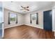 Bedroom features two windows for natural light and sleek, easy-to-clean hardwood floors at 431 Eastern Ave, St Cloud, FL 34769