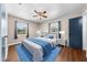 Bedroom features a cozy bed, windows for natural light, and fresh modern design at 431 Eastern Ave, St Cloud, FL 34769