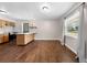 Bright dining area featuring hardwood floors, neutral walls, and a kitchen bar at 431 Eastern Ave, St Cloud, FL 34769