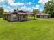 Exterior view featuring a well-maintained lawn, and a separate two-car garage at 431 Eastern Ave, St Cloud, FL 34769