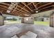 Open garage featuring concrete block walls, open ceiling, and exterior home view at 431 Eastern Ave, St Cloud, FL 34769