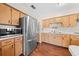 Spacious kitchen with wood cabinets, stainless steel appliances, and plenty of counter space at 431 Eastern Ave, St Cloud, FL 34769