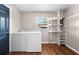 Bright laundry room with washer/dryer hookups and built-in shelving for storage at 431 Eastern Ave, St Cloud, FL 34769
