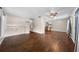 Inviting living room featuring hardwood floors, neutral paint, and a contemporary ceiling fan at 431 Eastern Ave, St Cloud, FL 34769