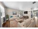 Comfortable living room with modern furnishings, hardwood floors, and large picture window at 431 Eastern Ave, St Cloud, FL 34769