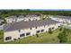 Aerial view of the rear of the community and green backyard spaces at 4850 Coral Castle Dr, Kissimmee, FL 34746