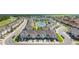 A peaceful townhome community complete with a serene pond and lush greenery throughout at 4850 Coral Castle Dr, Kissimmee, FL 34746