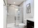 Bathroom featuring glass enclosed shower, and tile details at 4850 Coral Castle Dr, Kissimmee, FL 34746