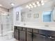 Bathroom featuring a double vanity and glass enclosed shower at 4850 Coral Castle Dr, Kissimmee, FL 34746