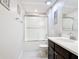 A clean bathroom features a tiled shower and a vanity sink, offering a serene atmosphere at 4850 Coral Castle Dr, Kissimmee, FL 34746