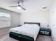 Bedroom featuring a ceiling fan and a large window at 4850 Coral Castle Dr, Kissimmee, FL 34746