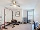 A bedroom is currently used as a gym with a weight bench, exercise bike and a comfortable reading chair at 4850 Coral Castle Dr, Kissimmee, FL 34746