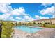 Beautiful community pool area features clear blue water and lounge seating at 4850 Coral Castle Dr, Kissimmee, FL 34746
