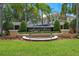An ornate Fiesta Key entrance sign is showcased, with manicured landscaping, on a beautiful sunny day at 4850 Coral Castle Dr, Kissimmee, FL 34746