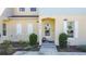 Inviting townhome with a landscaped front yard, shutters, and a covered entryway at 4850 Coral Castle Dr, Kissimmee, FL 34746