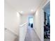 A carpeted hallway leads to rooms, with exercise equipment visible through one doorway at 4850 Coral Castle Dr, Kissimmee, FL 34746