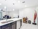 Open concept kitchen flowing into the living area, complete with an island and pendant lighting at 4850 Coral Castle Dr, Kissimmee, FL 34746