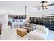 Spacious living room and kitchen area, featuring an open floor plan with tile flooring and modern fixtures at 4850 Coral Castle Dr, Kissimmee, FL 34746