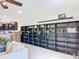 Living room with built in shelving and an open floor plan into the kitchen at 4850 Coral Castle Dr, Kissimmee, FL 34746