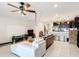 Comfortable living room with open floor plan, leading into the kitchen with a breakfast bar at 4850 Coral Castle Dr, Kissimmee, FL 34746