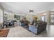 Open-concept living space in the clubhouse featuring tile floors, neutral paint and comfortable seating at 4850 Coral Castle Dr, Kissimmee, FL 34746