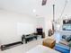 Open floor plan featuring tile flooring, a white board and view leading to the kitchen at 4850 Coral Castle Dr, Kissimmee, FL 34746