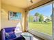 Screened in patio, with an outdoor sofa and view of a grassy field at 4850 Coral Castle Dr, Kissimmee, FL 34746
