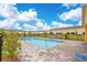 Community pool surrounded by lounge chairs and lush greenery, perfect for relaxing and enjoying the Florida sunshine at 4850 Coral Castle Dr, Kissimmee, FL 34746