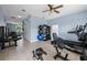 Workout room with exercise machines, weights, and mirrors for a complete fitness experience at 4850 Coral Castle Dr, Kissimmee, FL 34746