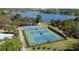 Community amenities featuring tennis courts, basketball court, swimming pool and a tranquil lake at 5231 Lemon Twist Ln, Windermere, FL 34786