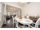 Open dining area showcases elegant decor, stylish table setting, and seamless flow to living room at 5231 Lemon Twist Ln, Windermere, FL 34786