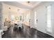Dining area with tile flooring, and elegant white table set near front door at 5231 Lemon Twist Ln, Windermere, FL 34786
