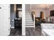 Inviting entryway featuring modern half bathroom, staircase, and seamless flow into the living area at 5231 Lemon Twist Ln, Windermere, FL 34786