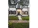 Charming two-story home with black shutters and well-manicured front yard at 5231 Lemon Twist Ln, Windermere, FL 34786