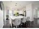 Kitchen with marble island featuring decorative seating and view of backyard at 5231 Lemon Twist Ln, Windermere, FL 34786