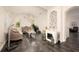Elegant living room featuring gray tile flooring, high ceilings, and ornamental fireplace at 5231 Lemon Twist Ln, Windermere, FL 34786