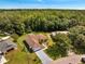Aerial view showcasing the home's location with a large wooded area in the background at 640 Floridian Dr, Kissimmee, FL 34758