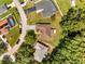 Aerial view of the home featuring a well-maintained roof, landscaping, and nearby neighborhood amenities at 640 Floridian Dr, Kissimmee, FL 34758